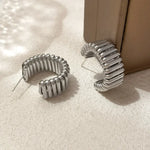 Load image into Gallery viewer, Minimalist Needle Hoops – Bold. Clean. Elevated.
