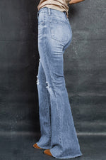 Load image into Gallery viewer, Distressed Raw Hem Flare Jeans Pants
